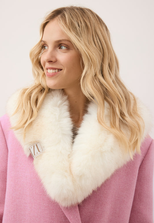 Model looking to the side wearing the cream faux fur FLOOFU scarf.