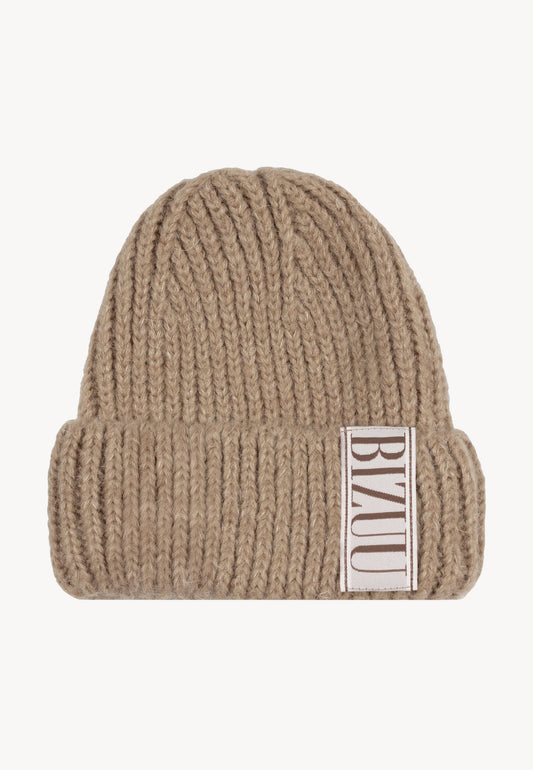 Beige LORRO wool beanie with a logoed label on the front.