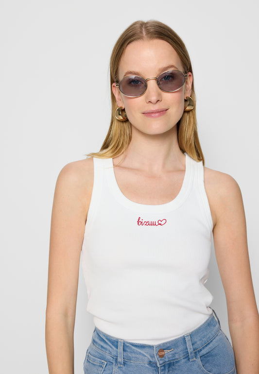 Close-up of the model in a white LOVIE top with red Bizuu lettering and MENFI sunglasses.