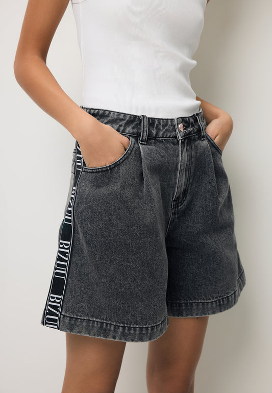 Close-up of the black MIREYA denim shorts with a logo side stripe.