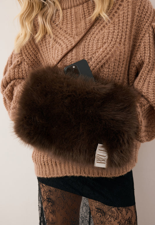 Close-up of the brown faux fur MUFFIE muff.