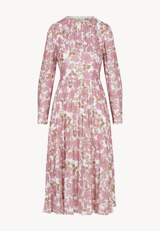 The front of a pink dress with a floral print by NYLA with a pleated hem.