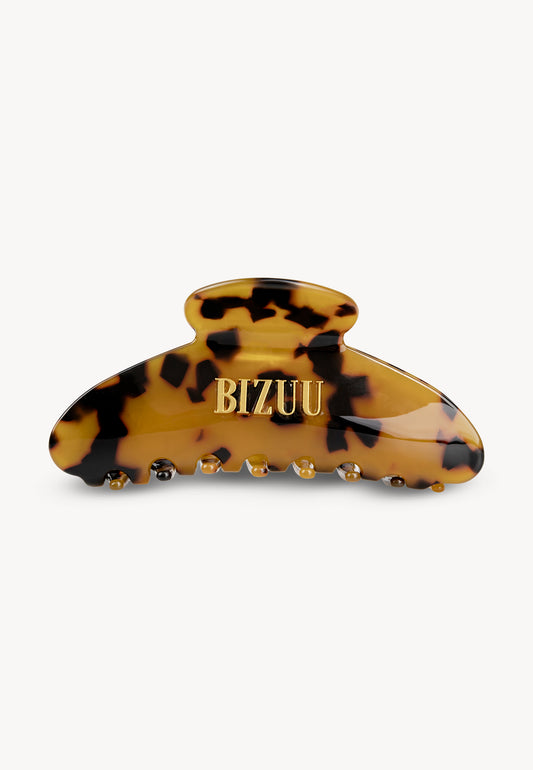 Elegant tortoiseshell ROAR hair clip with BIZUU logo.