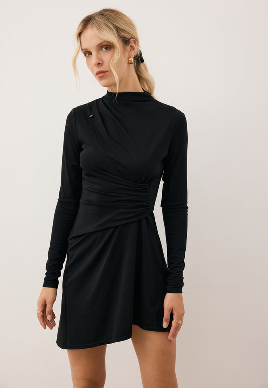 Model wearing the black SALOMEI mini dress with front ruching.