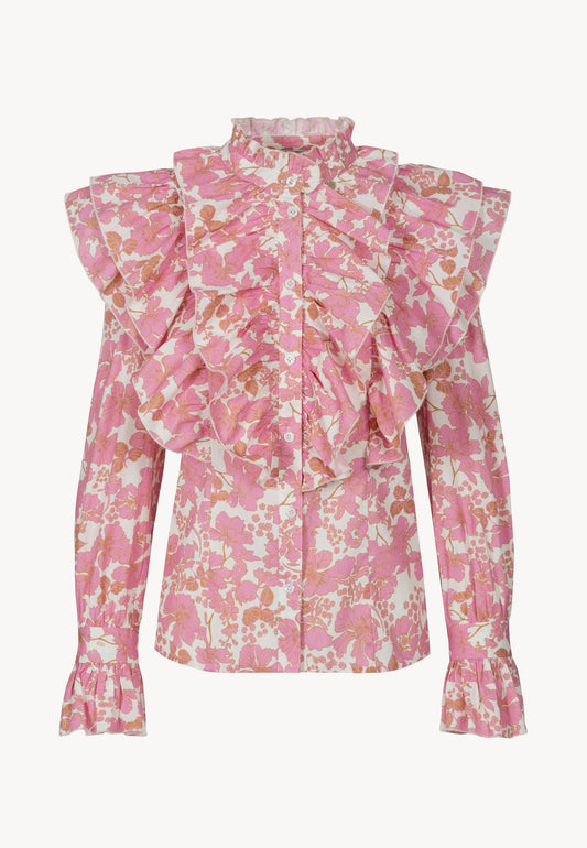 The front of the SANNI shirt features a floral print with decorative ruffles.