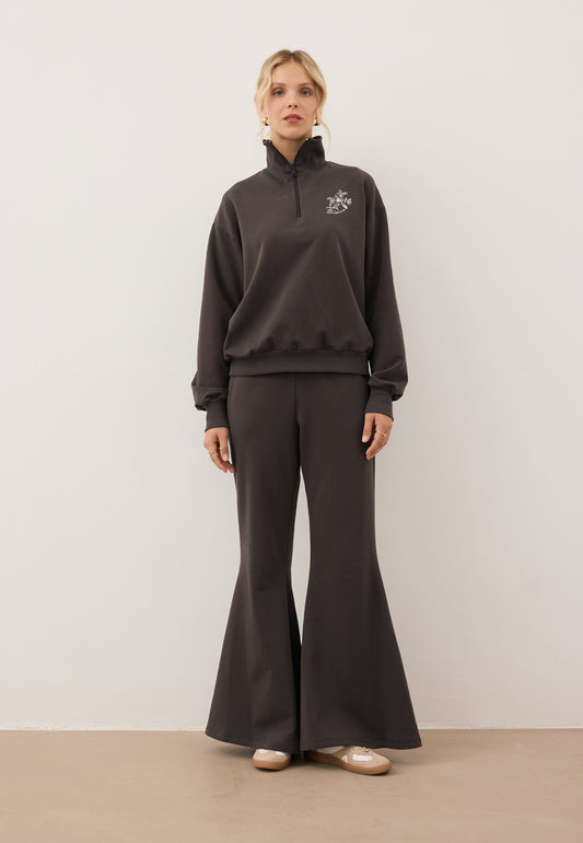 Model wearing the chocolate-colored tracksuit set with the TANSY half-zip sweatshirt and ZEIA wide-leg trousers.