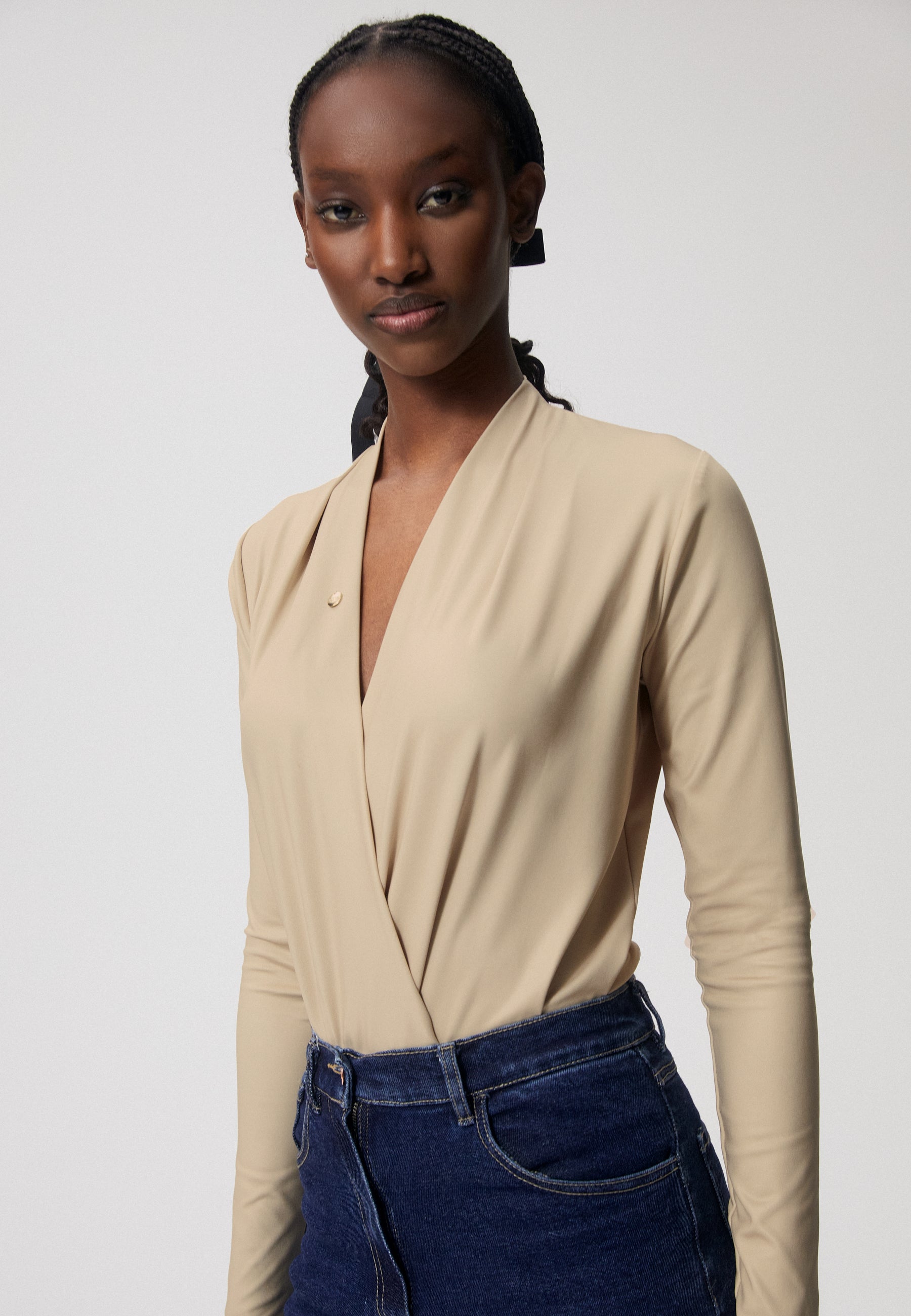 LOMMA beige bodysuit with a deep V-shaped neckline