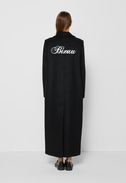 Coat with a patch on the back with the logo, LOXIMA in black