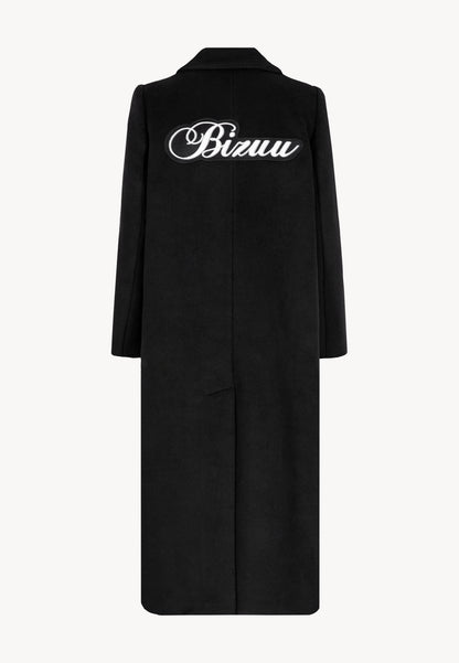 Coat with a patch on the back with the logo, LOXIMA in black