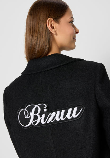 Coat with a patch on the back with the logo, LOXIMA in black