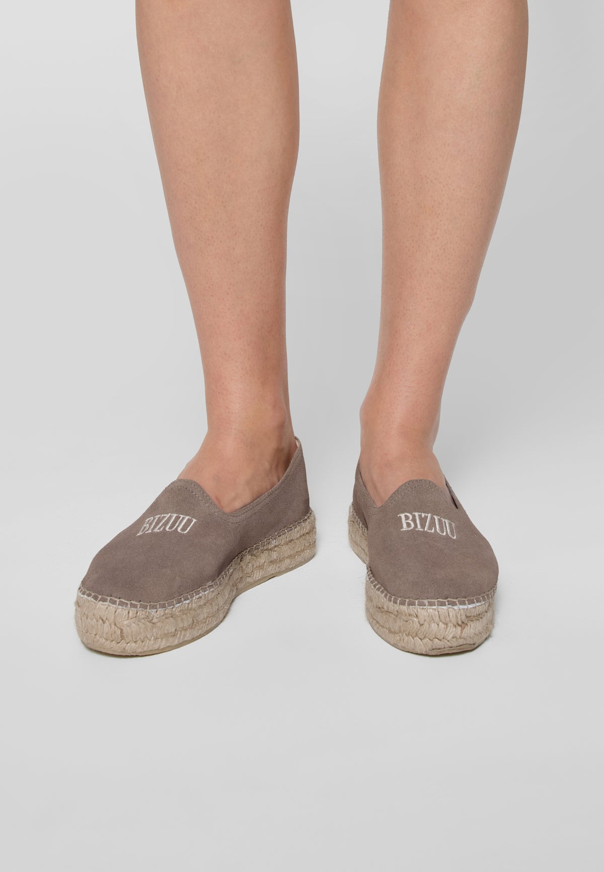 Espadrilles in taupe color AYLA on the leg, top view.