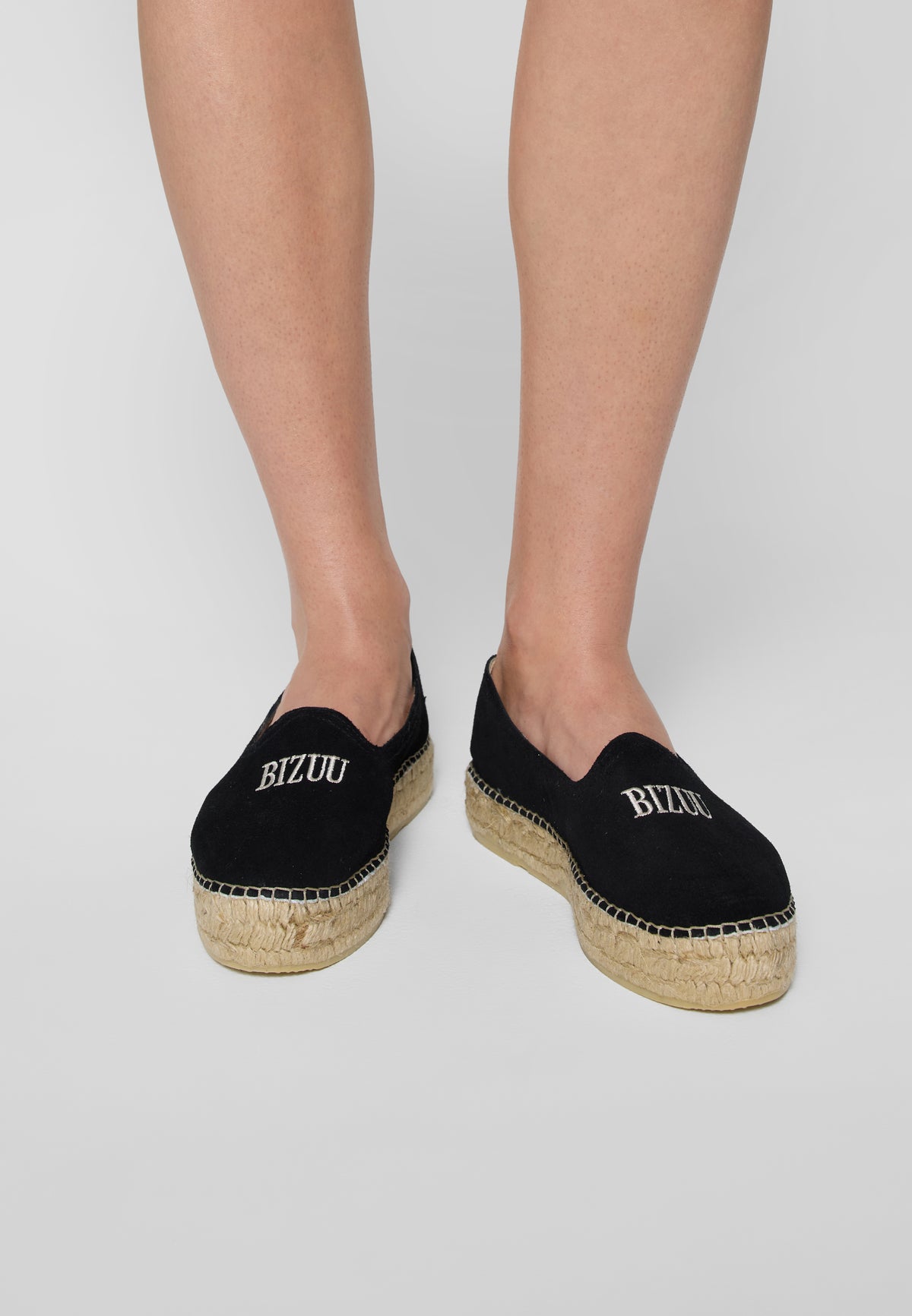 Black espadrilles AYLA on the leg, top view.