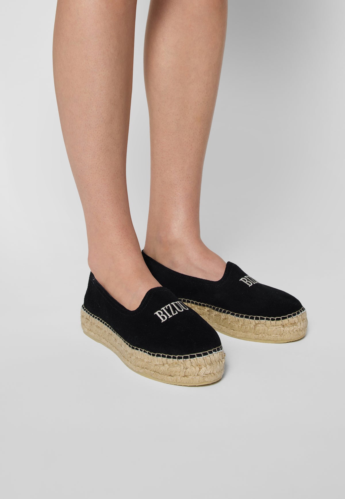 Black espadrilles AYLA on the leg, 3/4 view.