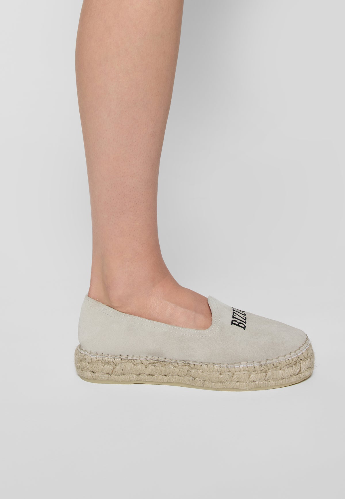 AYLA cream espadrilles on the leg, side view.