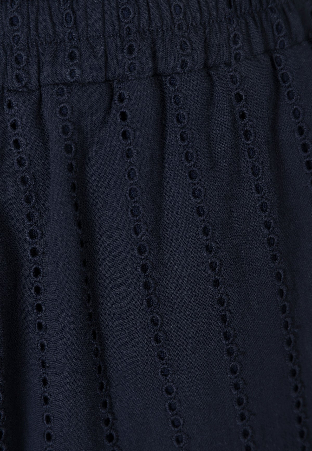 Close-up of the English embroidery on the LAVENDOU pants.
