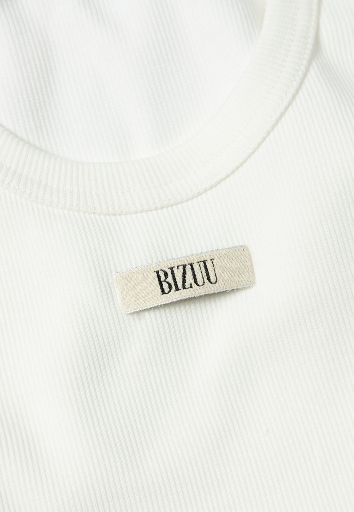 A close-up of the Bizuu logo on the front of the EJRIS top.
