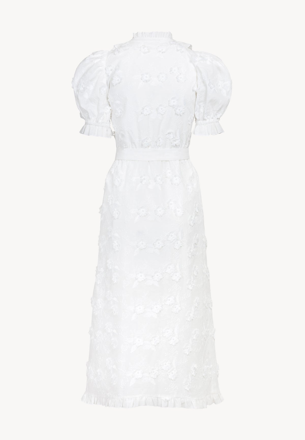 The back of a white midi dress with the cut of a schmisserie tied at the waist.