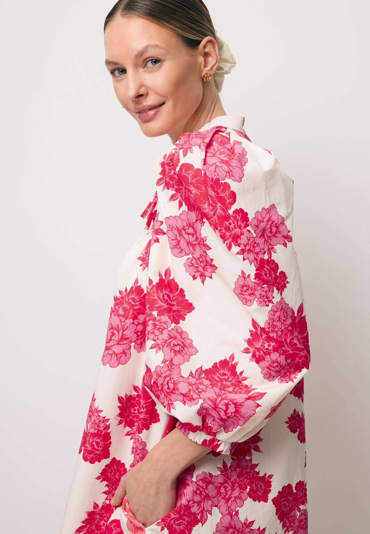 Close-up of the puffed sleeve on the AYOTE dress in the original print.