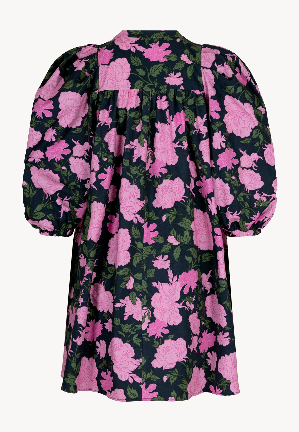 The back of the mini dress with a floral print by AYOTE.