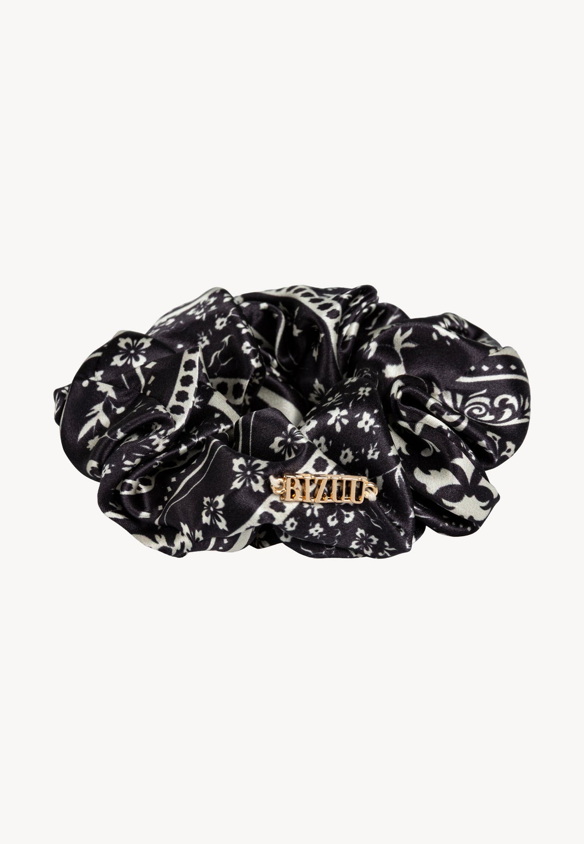 Black BANDI silk scrunchie with decorative gold logo.