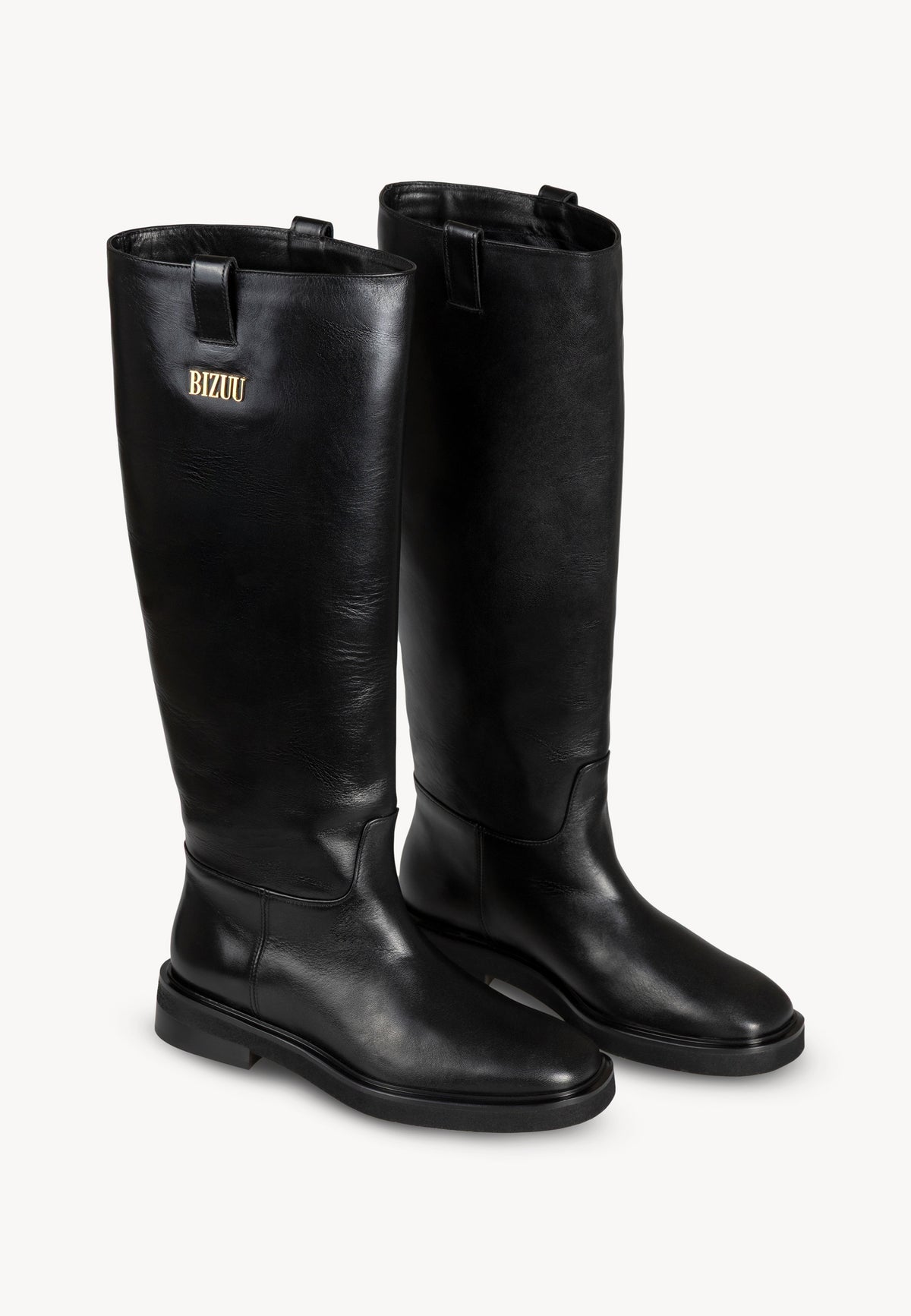 Black CALYX leather boots shown from the back.