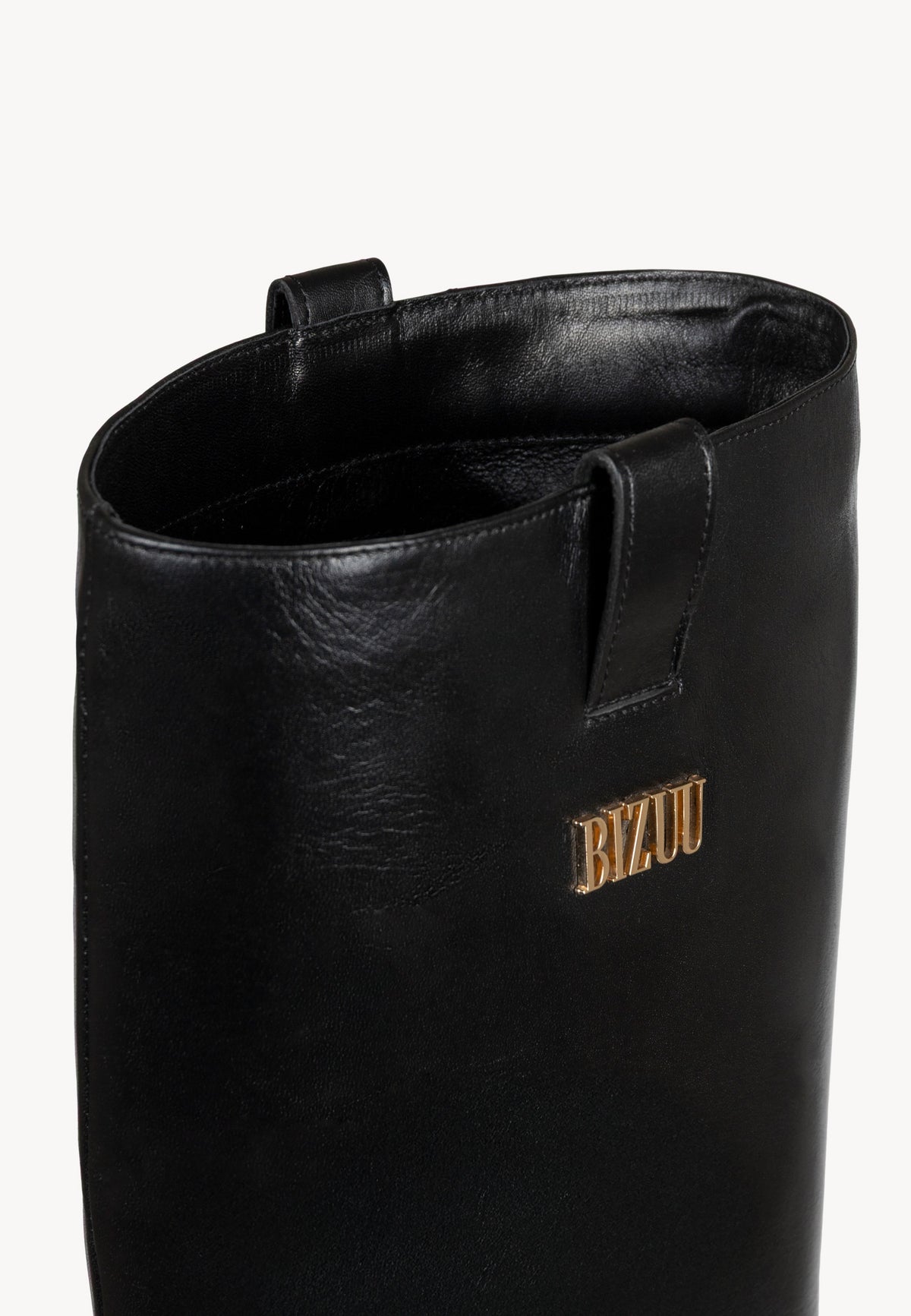 CALYX leather boots worn by the model.