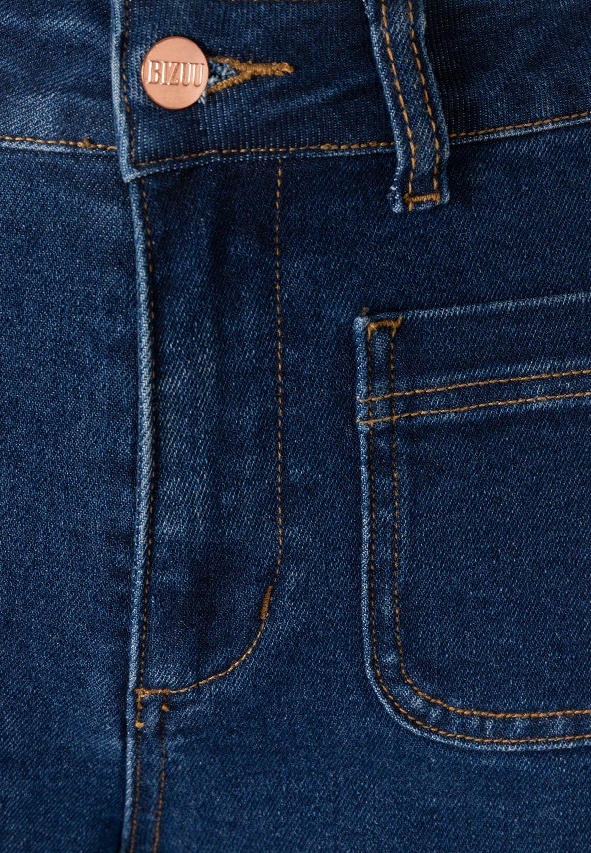 Close-up of the zipper and front pocket of DELPHI navy blue jeans.