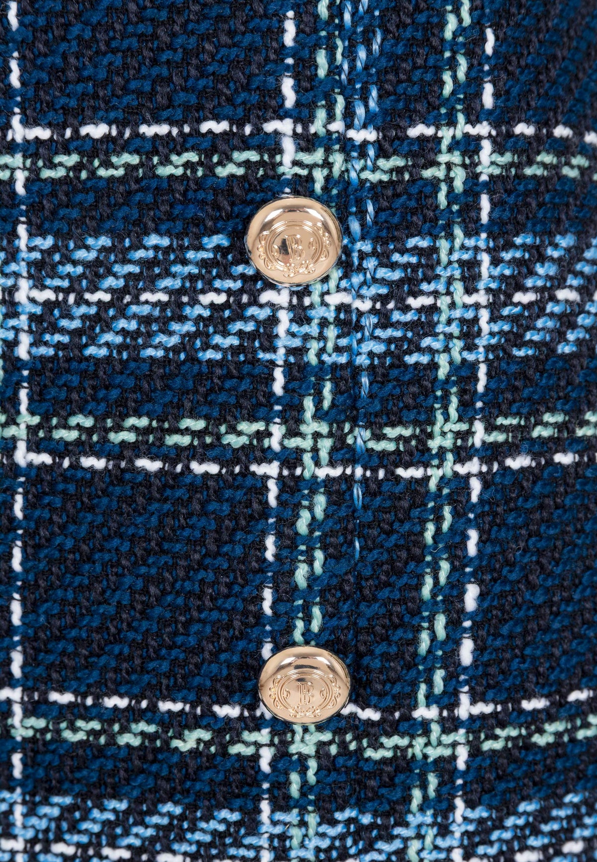 Close-up of the branded buttons on the DISSA skirt.