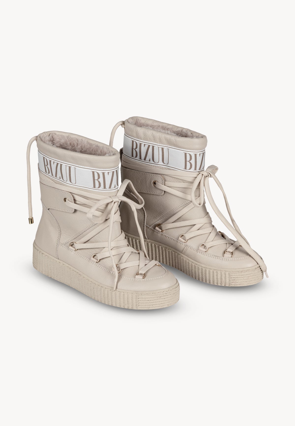 Beige ESPEN snow boots with decorative logo and laces, positioned at an angle.