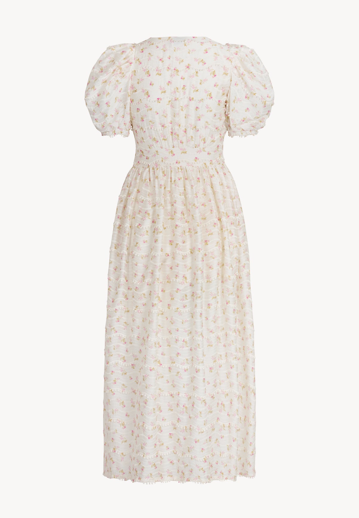 The back of the dress in small flowers with buffeted FIFFI sleeves.