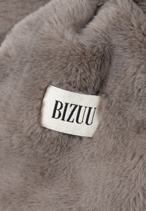 FLUFFY taupe scarf with a branded label.