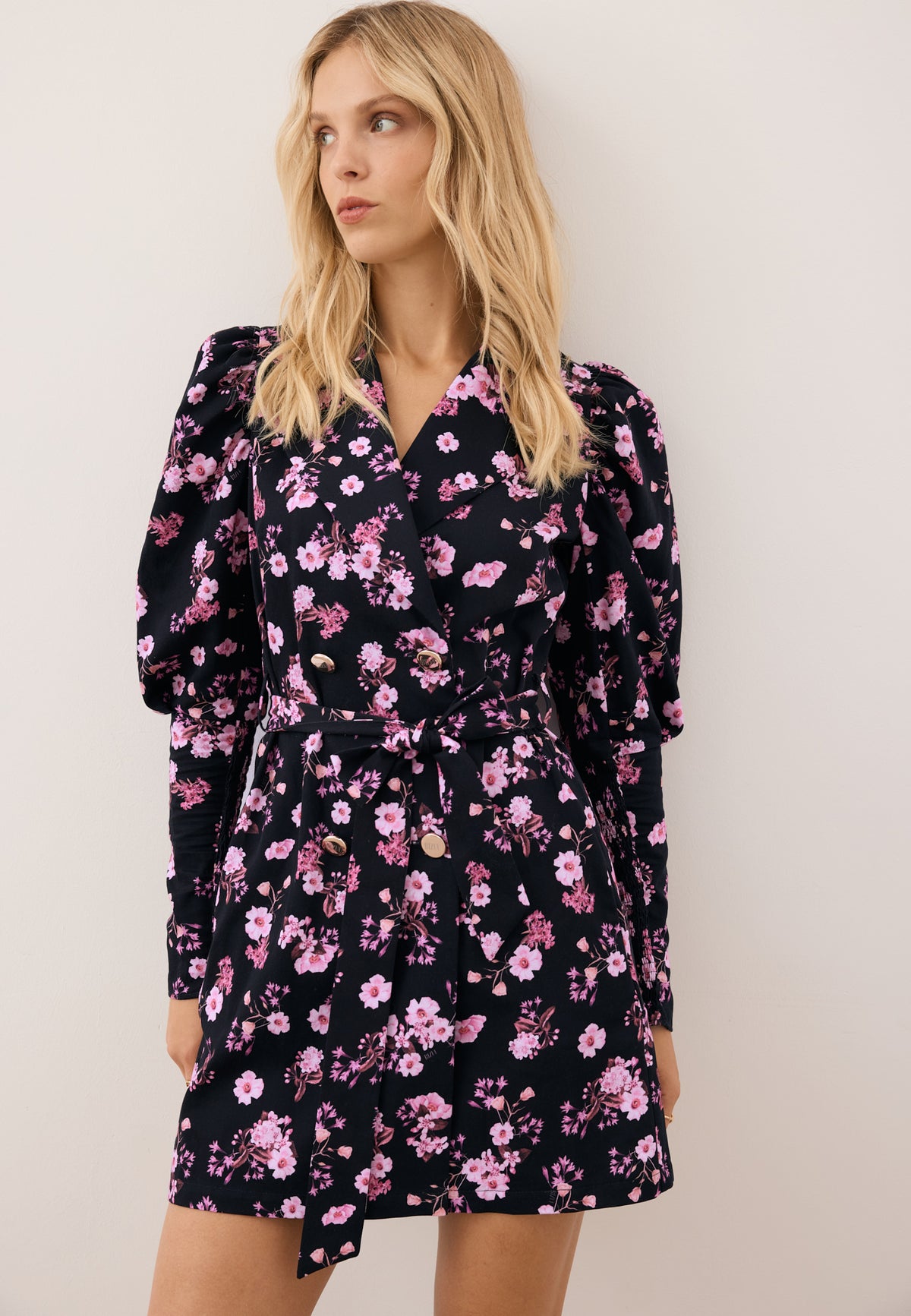Model wearing the floral GEORGINA dress, looking to the side.