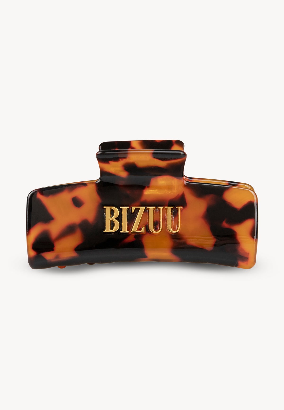Tortoiseshell GLIMMA hair clip with BIZUU logo.