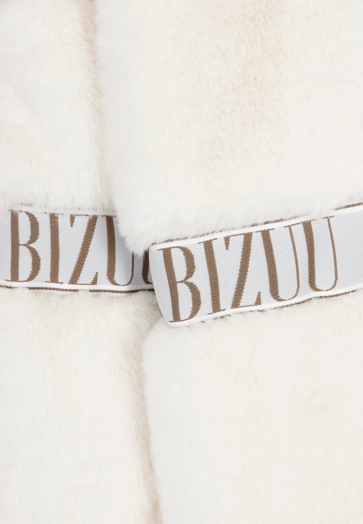Branded stripe on the short cream GREGORIA faux fur coat.