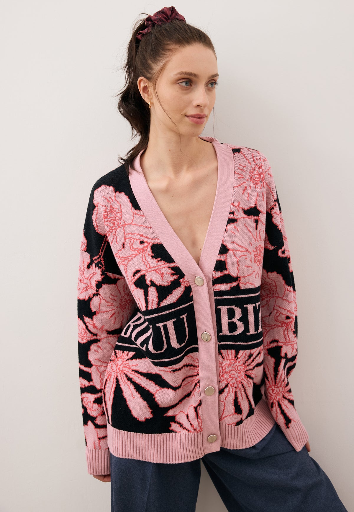 Model looking to the side wearing the HYLES cardigan with the original print.