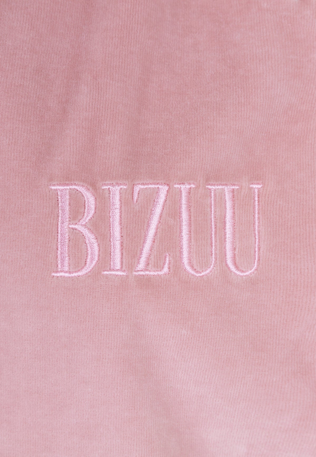 Close-up of the embroidered Bizuu logo on the front of the IANELLA sweatshirt.