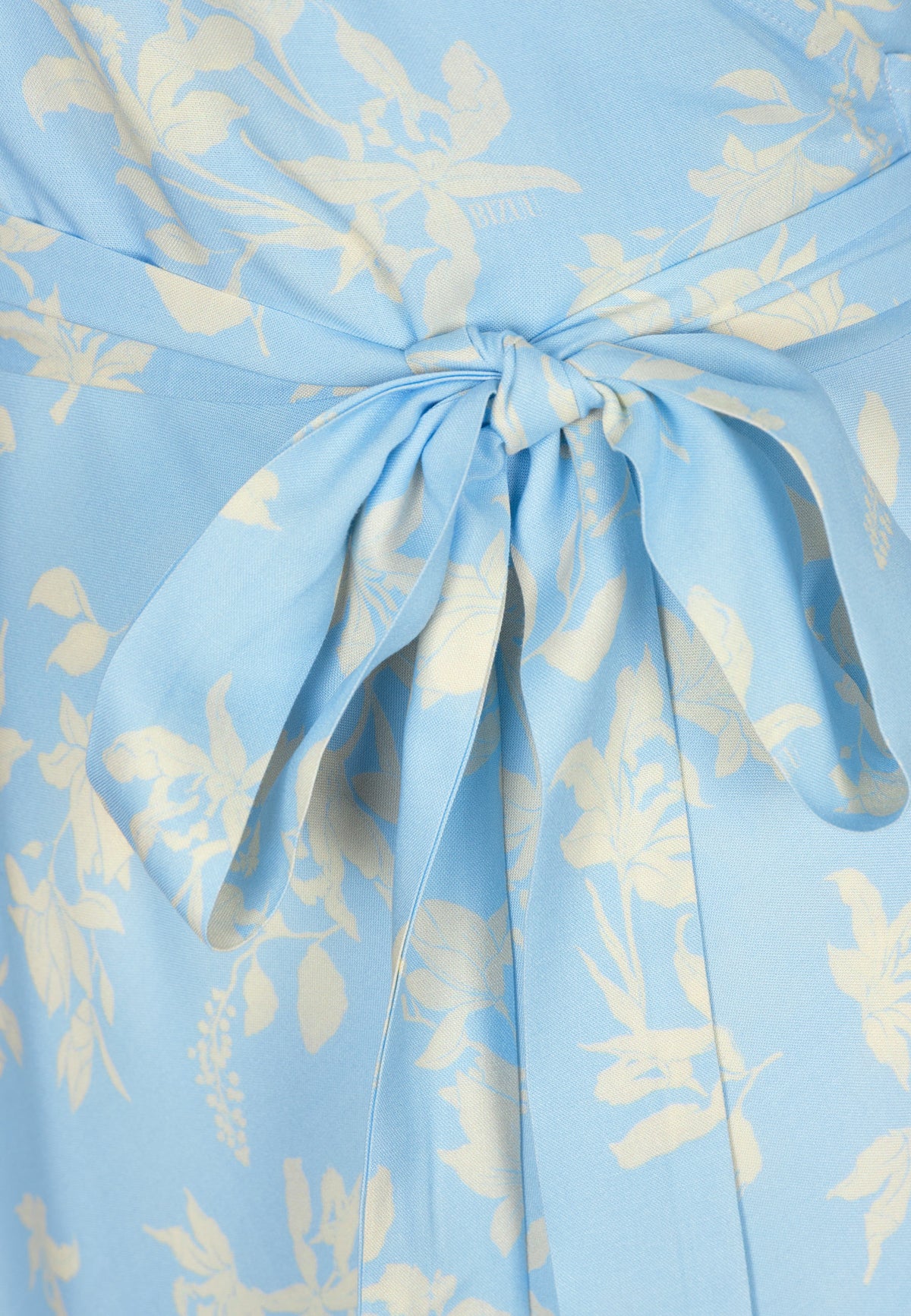 A close-up of the envelope binding at the ISLAY dress.