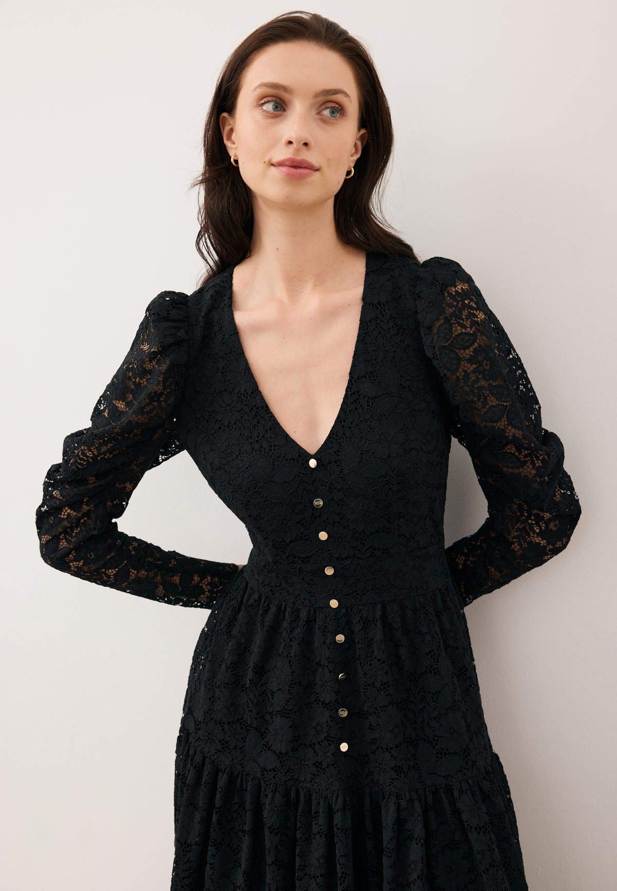 Close-up of the model wearing the ISORELLA lace dress.