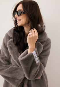 Taupe LIVORNO faux fur coat with logo tape on the back
