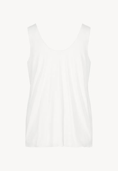 Cream LULY top with a relaxed fit