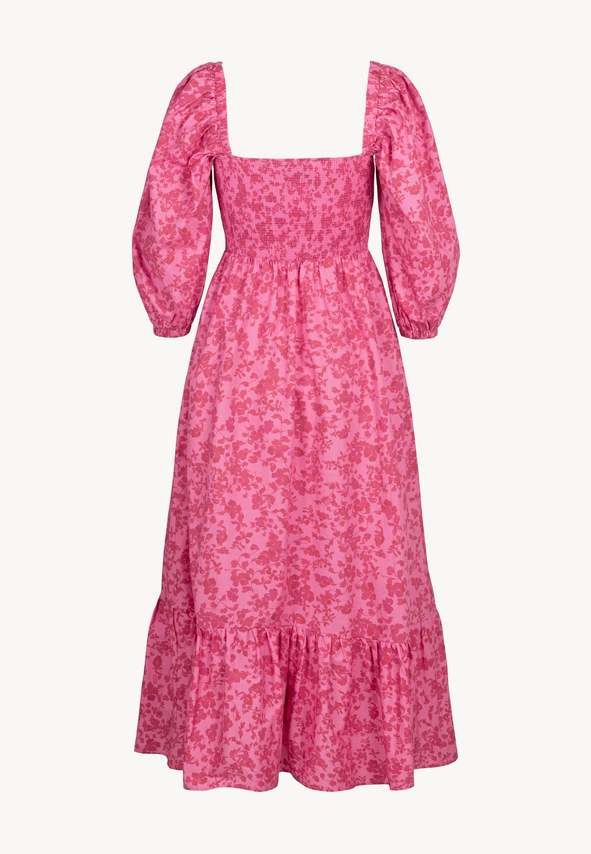 The back of the floral LUMIA dress with buffeted elbow-length sleeves.