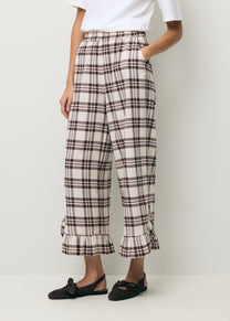 Checkered trousers with a ruffle on the leg MELLA