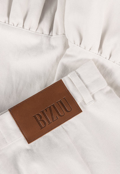 Cream NEYO shorts finished with ruffles