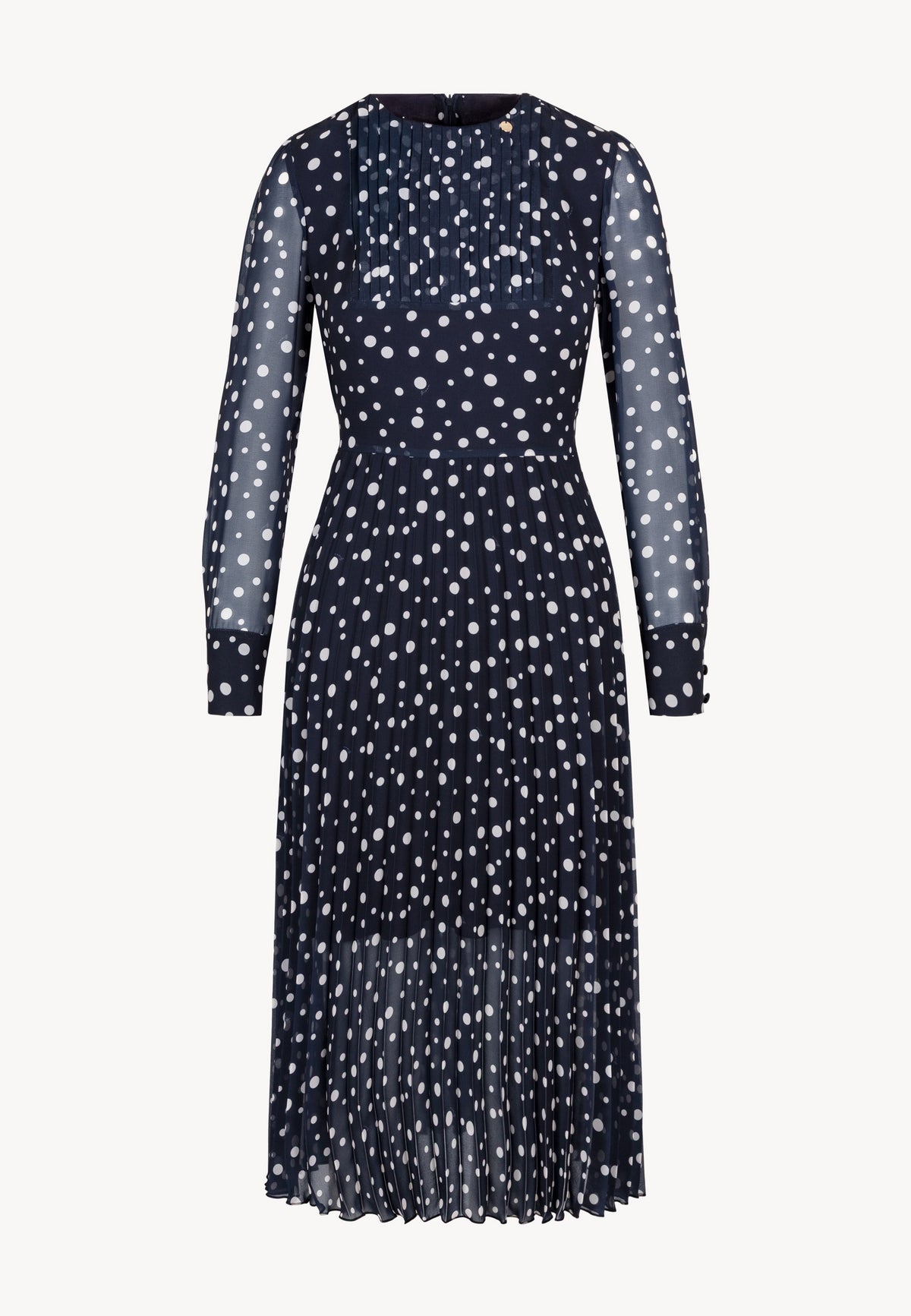 Close-up of the polka dot print with logo on the NYLA dress.