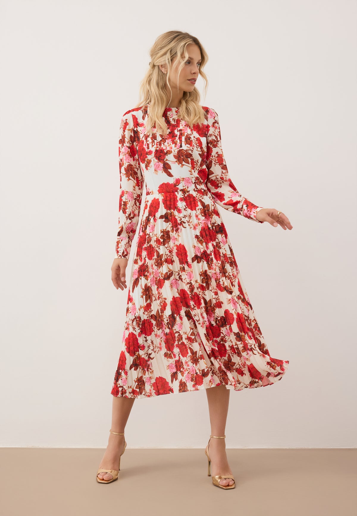 Model in motion wearing a NYLA midi dress with a floral print.