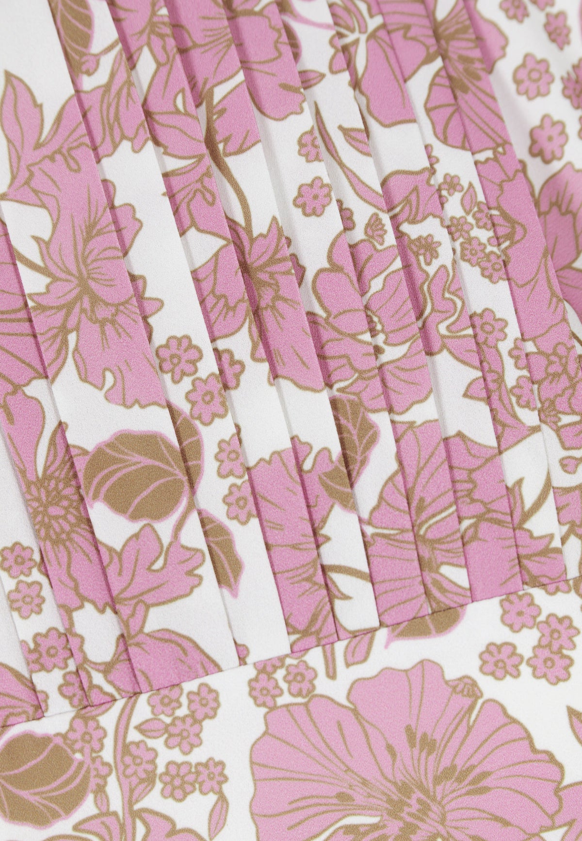 Close-up of the pleats on the neckline of the NYLA dress in pink print.