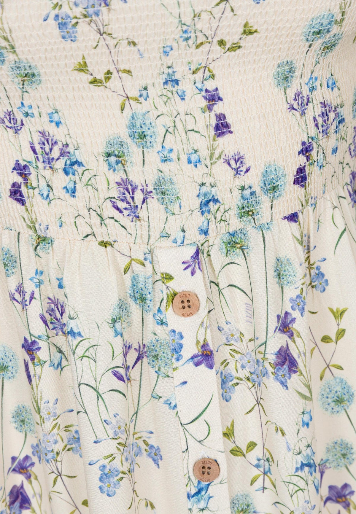 A close-up of the print used on the fabric of the PATRYA dress.