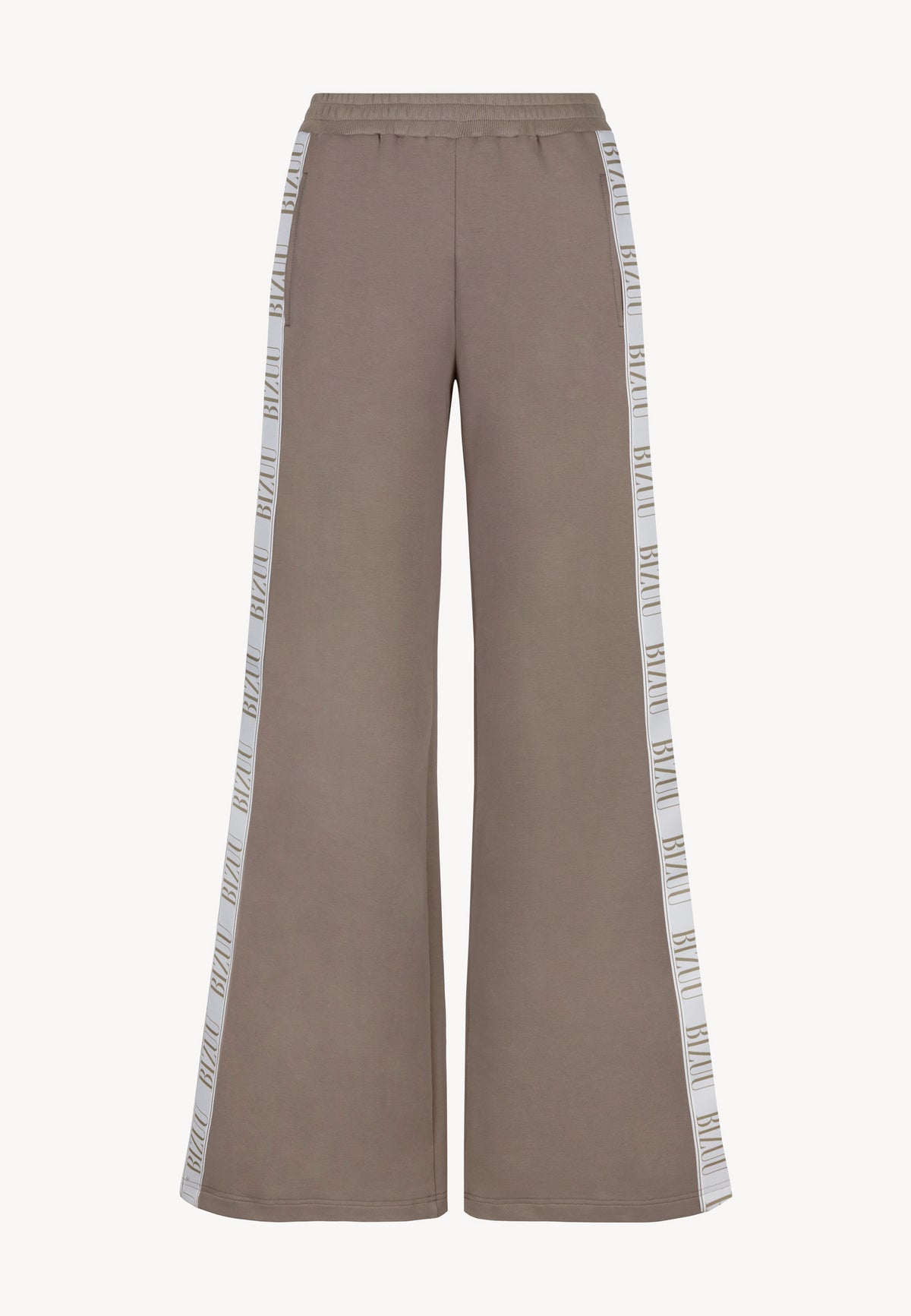 The front of PETRA's loose-fitting sweatpants with logo stripe on the legs.