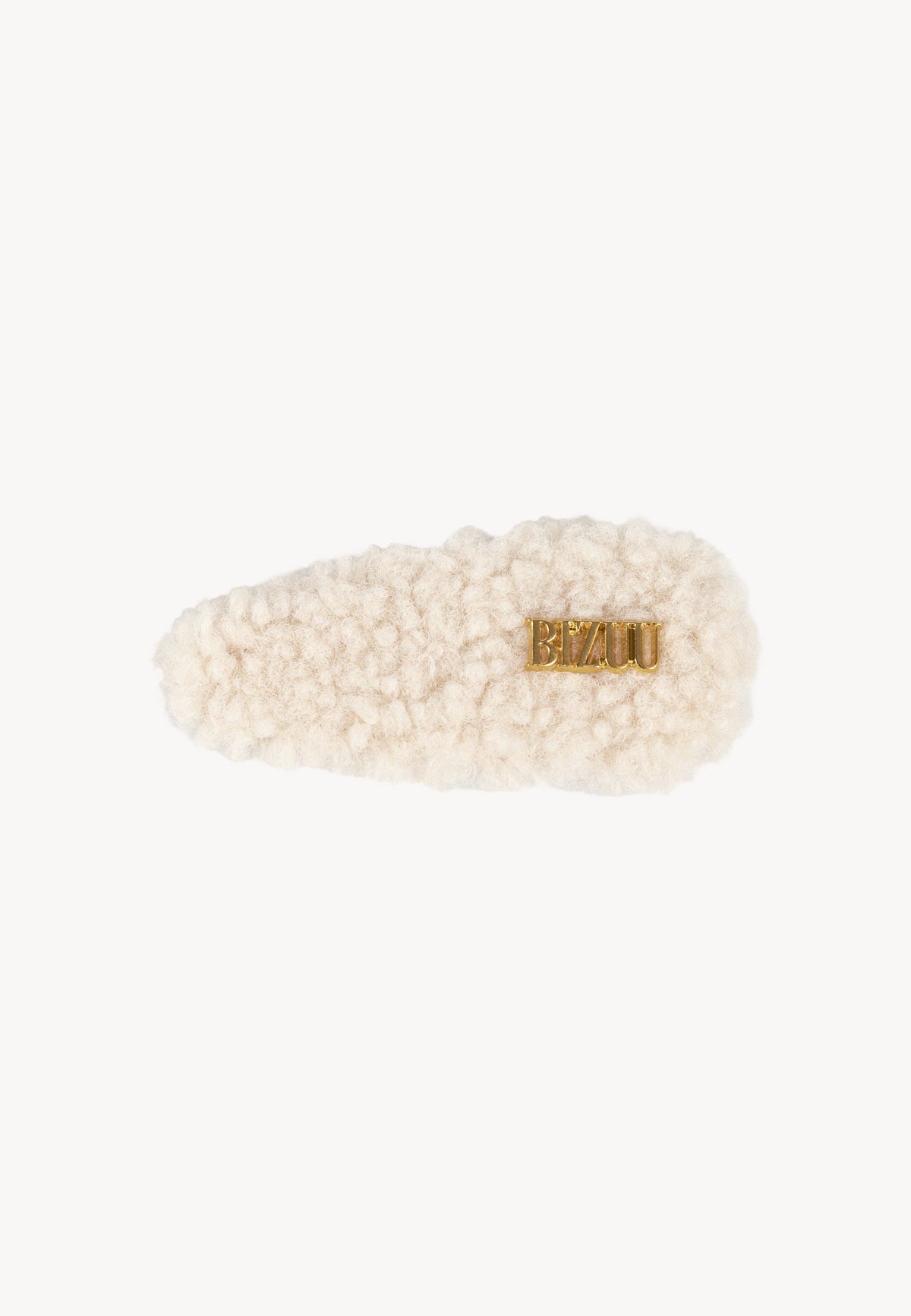 Cream shearling PLUSHA hair clip with gold logo.