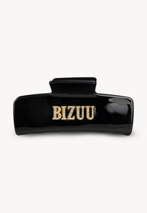 Black RHODI hair clip with logo.